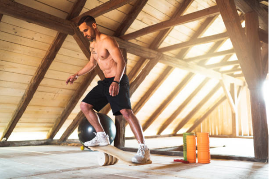 Core rotation combined with balance board movements for targeted muscle engagement.