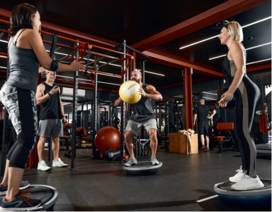 Core chain training with balance board: transverse abdominis and obliques.