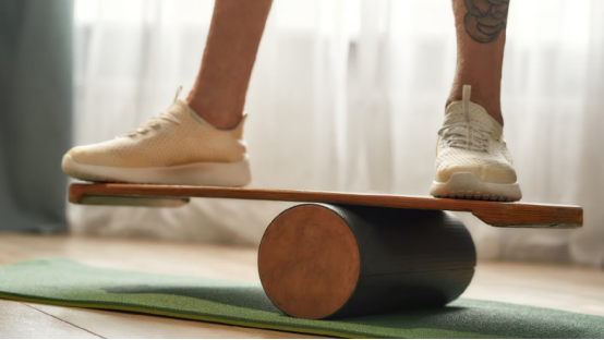 Child balancing on a board to improve coordination and brain development.