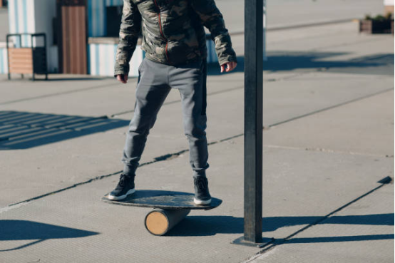 Elderly person using a balance board for fall prevention training