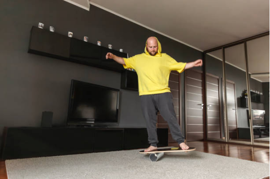 Beginner balance board training for core activation and stability.