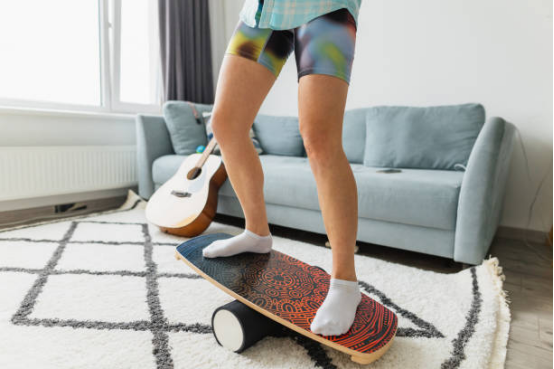 Beginner using balance board to improve ankle flexibility