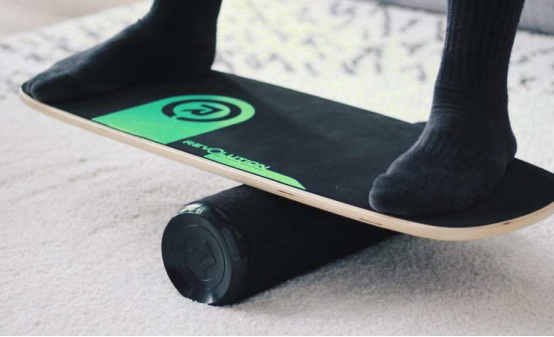 athlete practicing deep core activation on balance board
