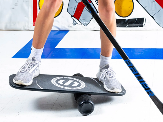 person doing balance board low intensity training at home