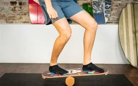Person standing on a colorful balance board, improving core strength and balance.