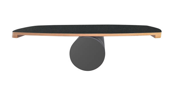 Wooden balance board with black grip top and dark roller on white background.
