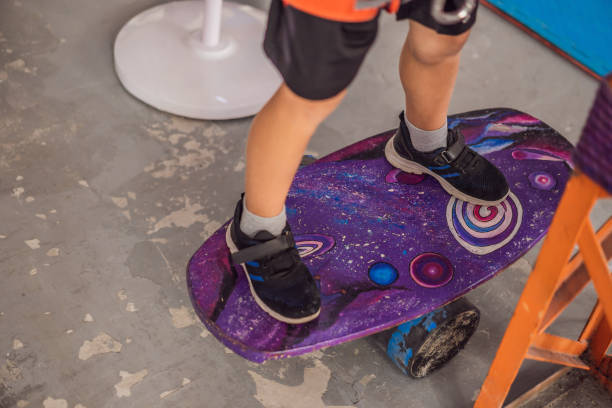 Child's feet on a vibrant purple balance board, enhancing coordination and physical development.